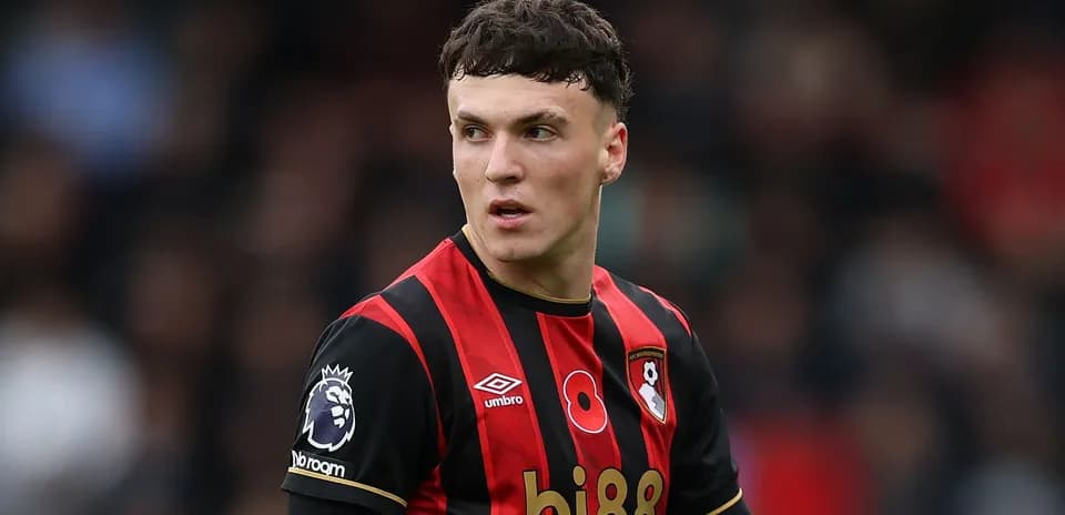Bournemouth player in black and red jersey during match