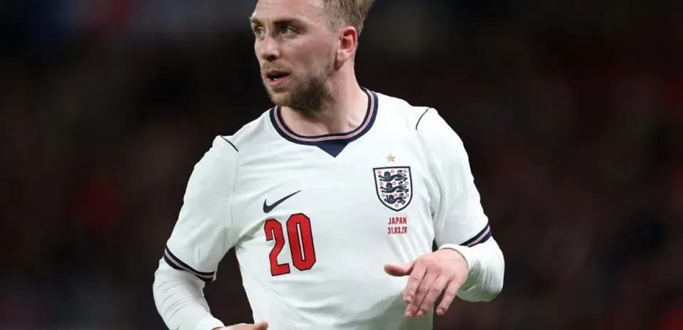 Player wearing England kit during football match