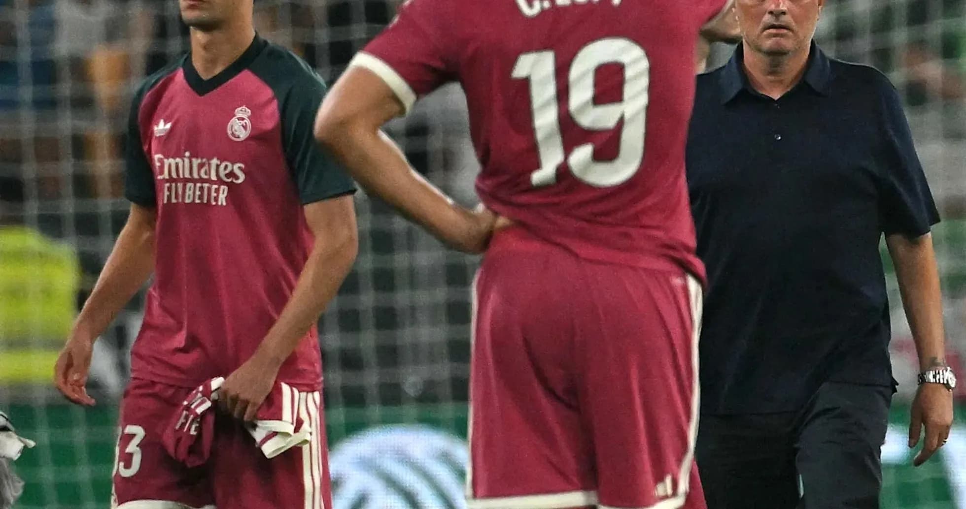 Players and coach discussing after match loss