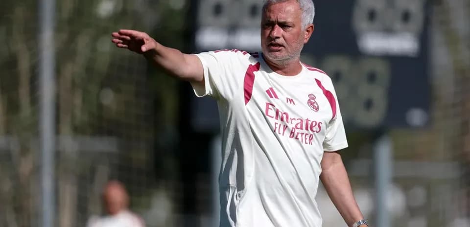 Coach directing players during training session