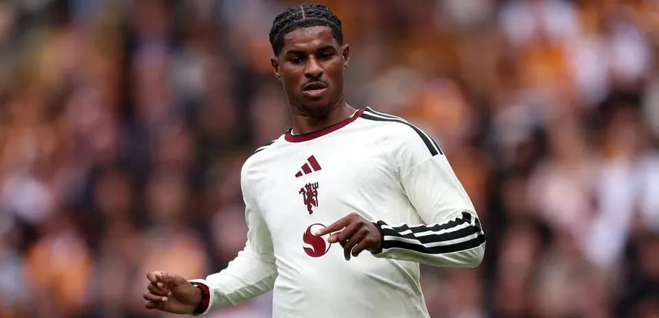 Player in white jersey during football match