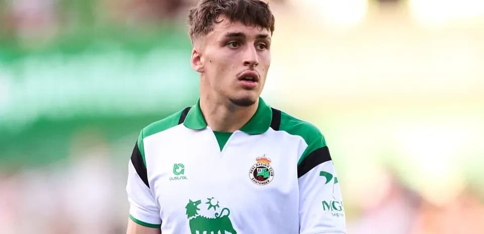 Player wearing Racing Santander jersey on the field
