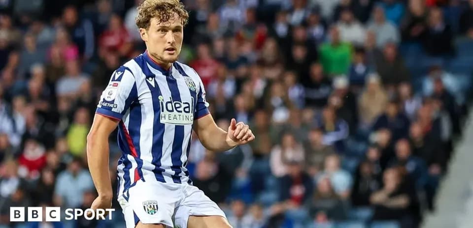 Player in striped jersey during football match