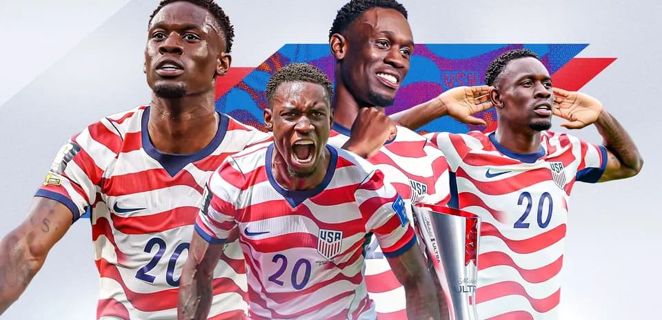 Player in USA jersey celebrating with trophy