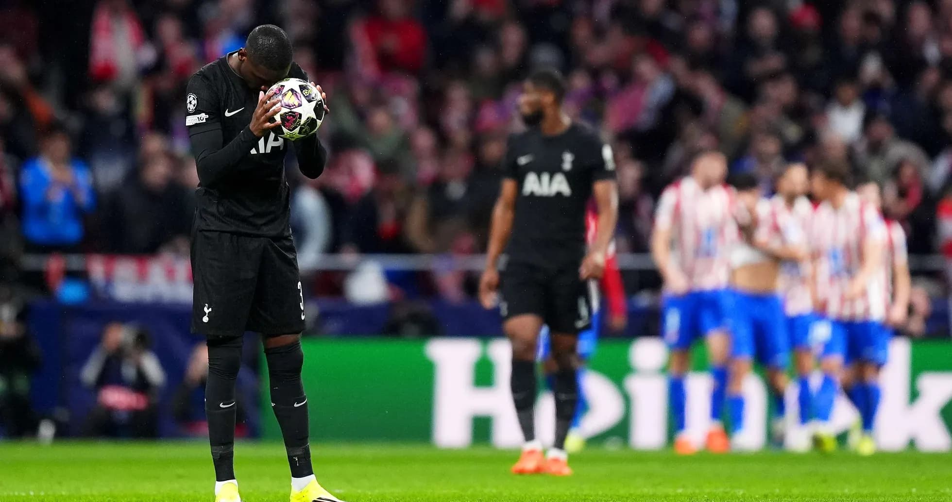Tottenham player holding ball during Champions League match