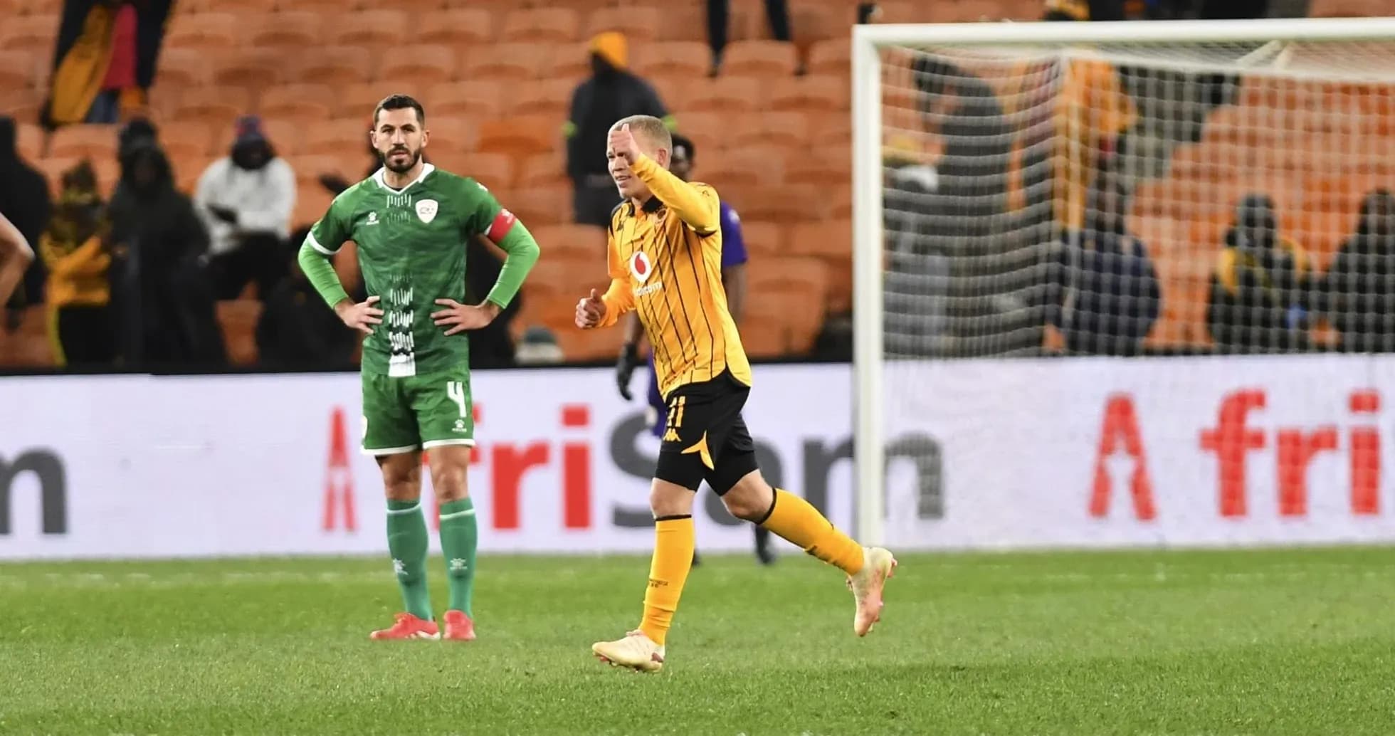 Player celebrating while opponent looks on in disappointment