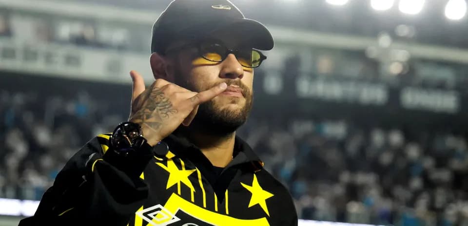 Person making a gesture in a stadium setting