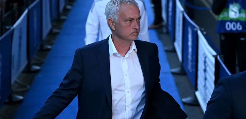 Manager walking through blue carpeted entrance area