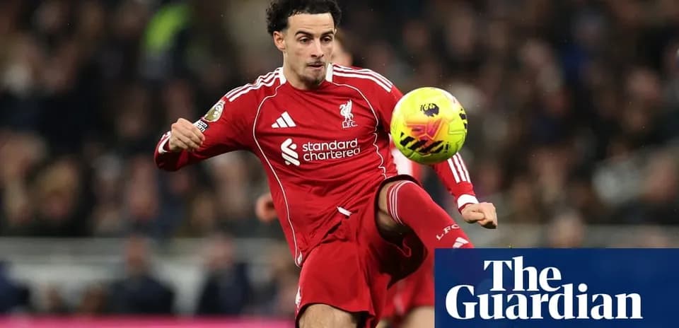 Liverpool player striking the ball during match