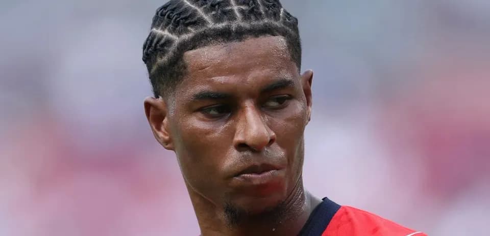 Player with braided hair during match warm-up