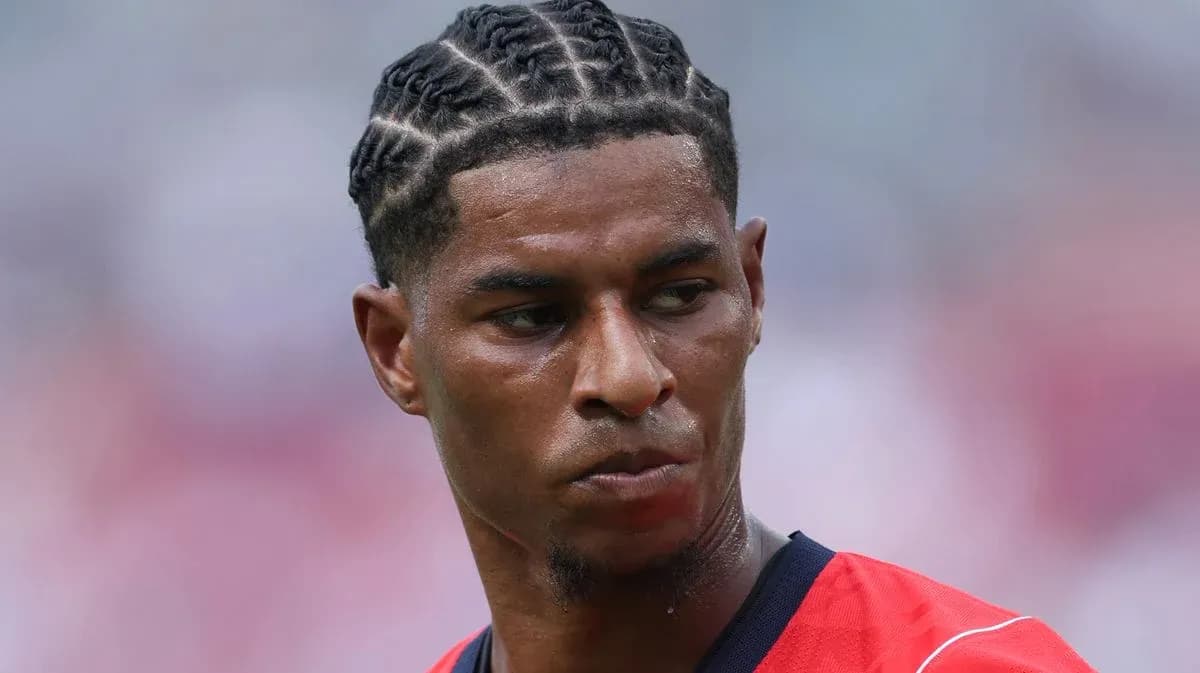 Player with braided hair during match warm-up