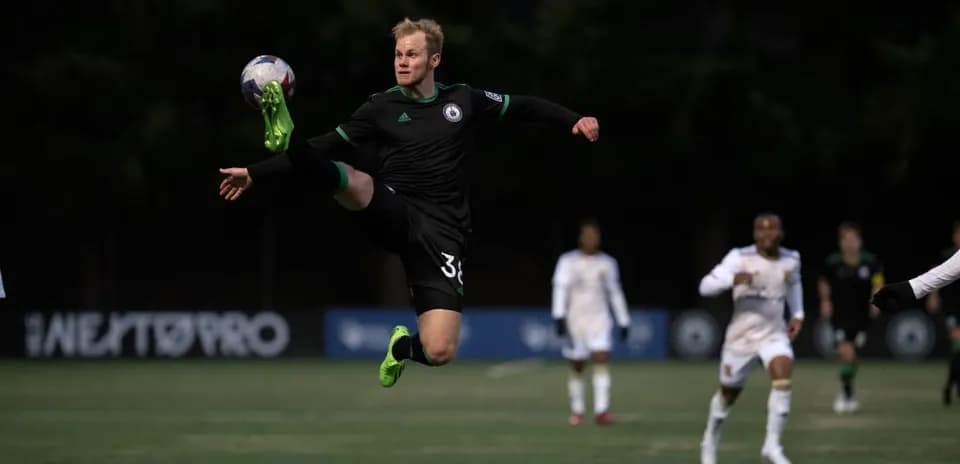 Goalkeeper making a save during match action