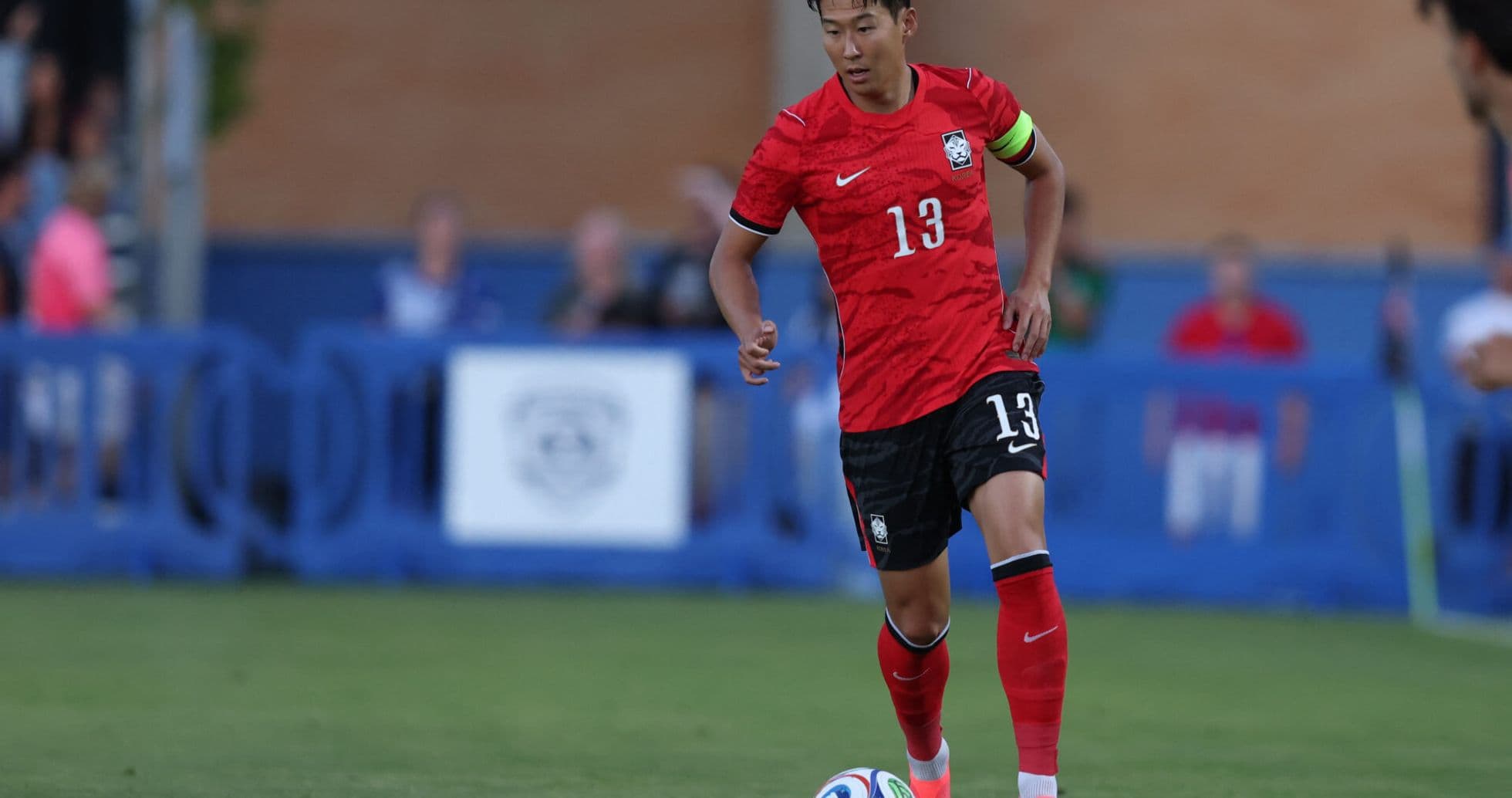 South Korean player dribbling during match