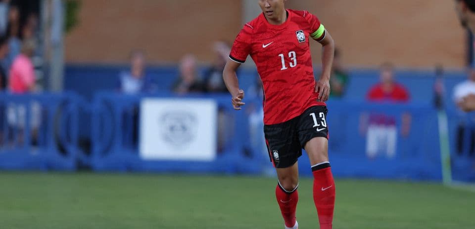 South Korean player dribbling during match