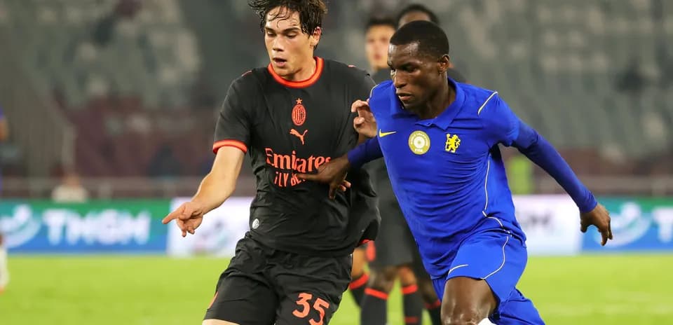 Two players battling for the ball during match