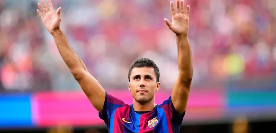 Player waving to fans during match at stadium