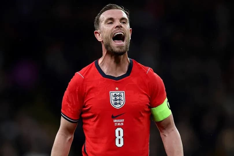 Player celebrating in England's red kit during match