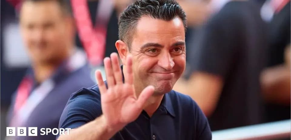 Coach waving to fans during a public event