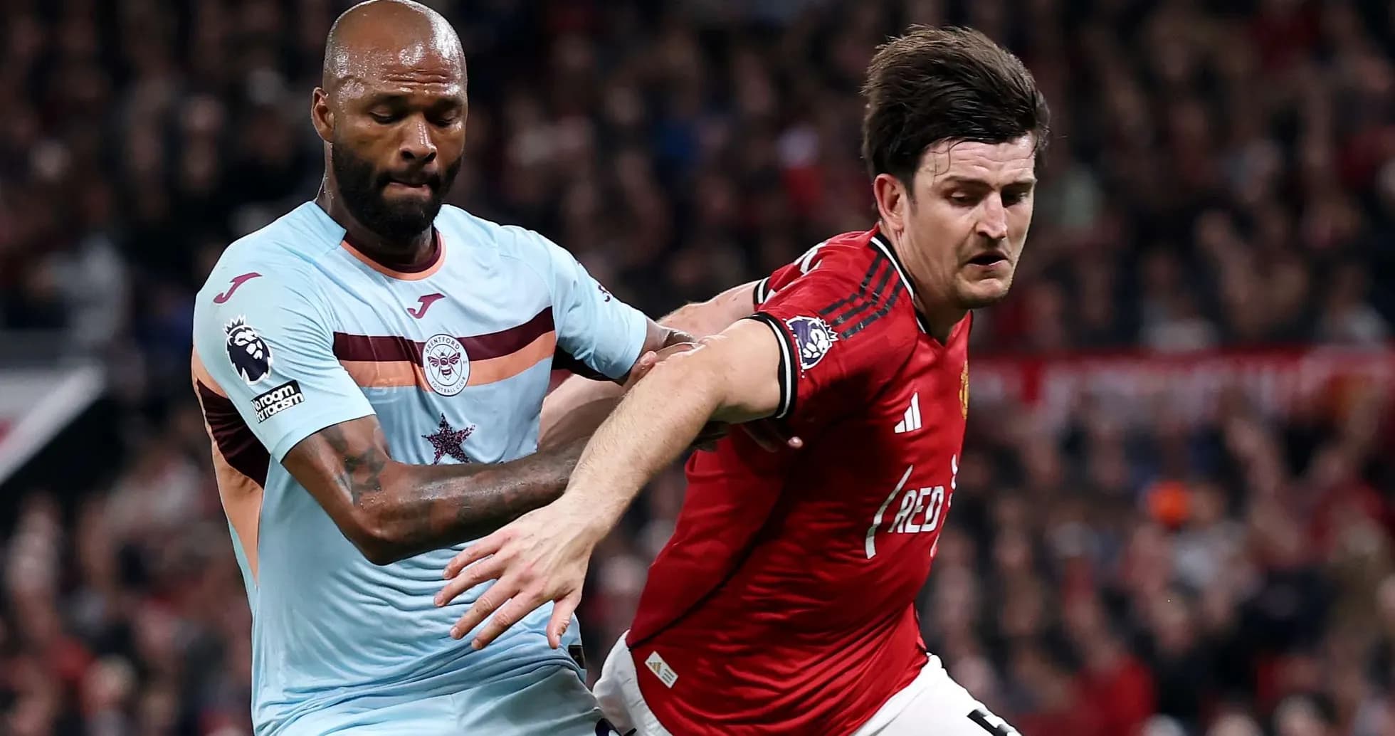 Manchester United player battling with Brentford opponent