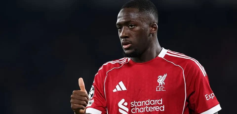 Player in red Liverpool kit giving thumbs up