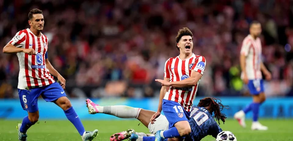 Atletico Madrid player falling during match