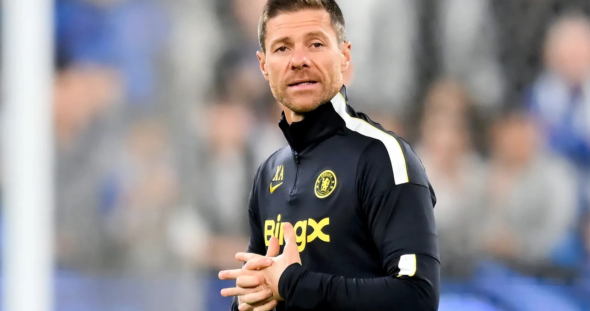 Coach speaking on the sidelines during a match