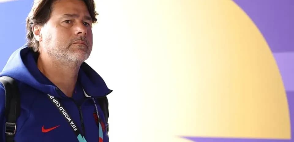 Coach entering venue wearing FIFA World Cup lanyard
