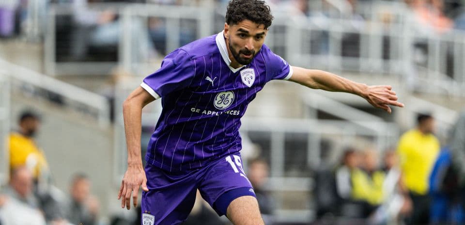 Louisville City player in action during match