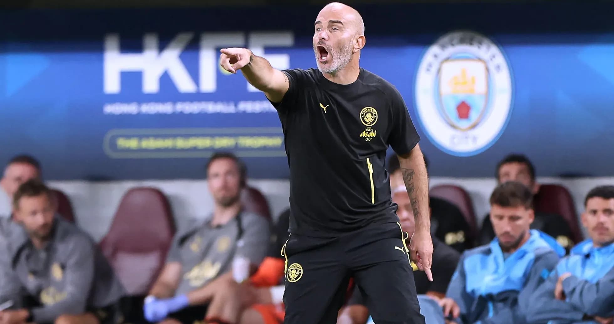 Coach instructing players from the sidelines during match