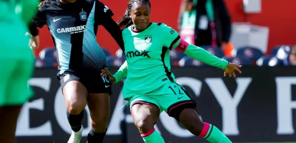 Players competing for the ball during NWSL match