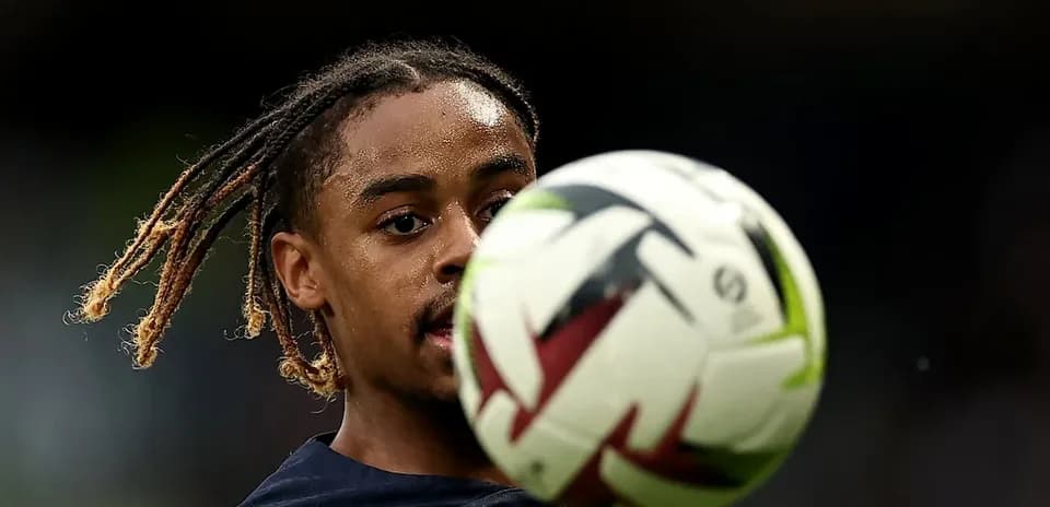 Player controlling a soccer ball during training