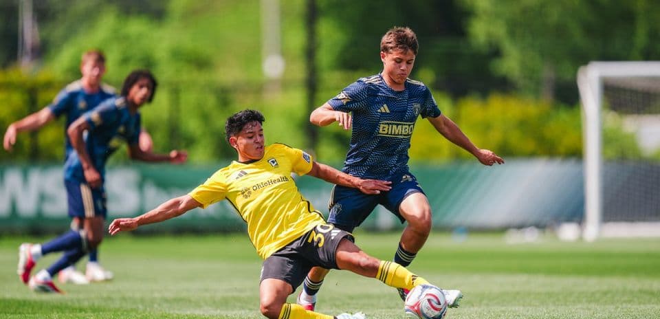 Player challenging for the ball during match