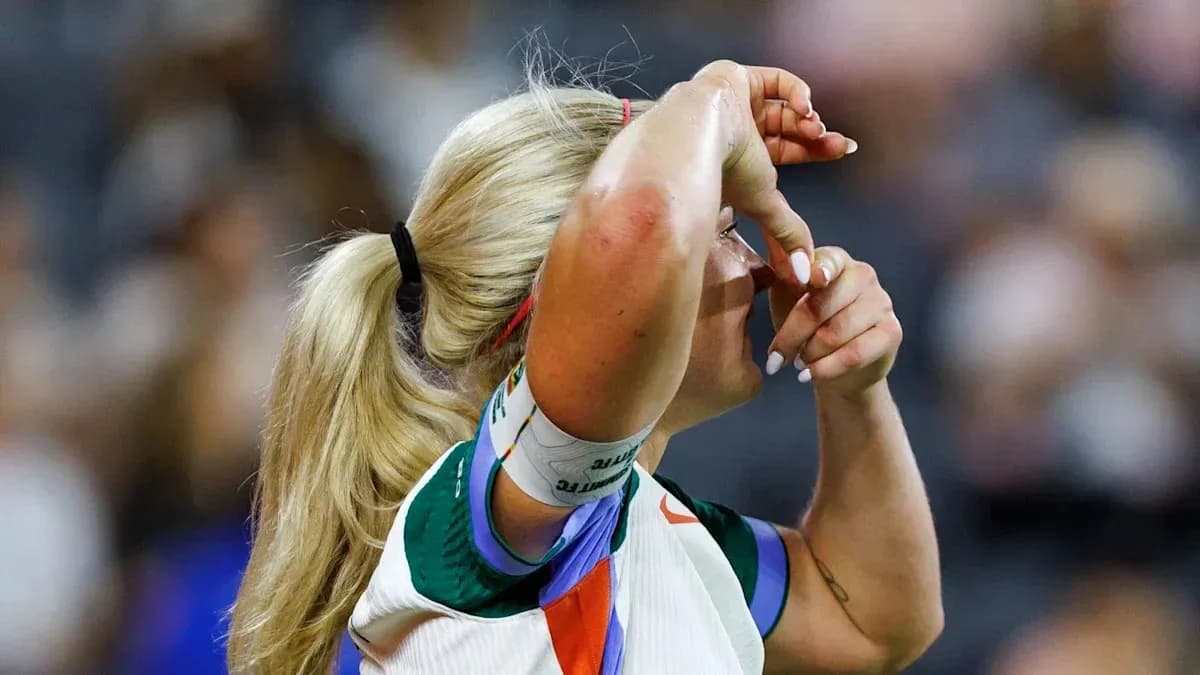 Athlete adjusting headband during sporting event