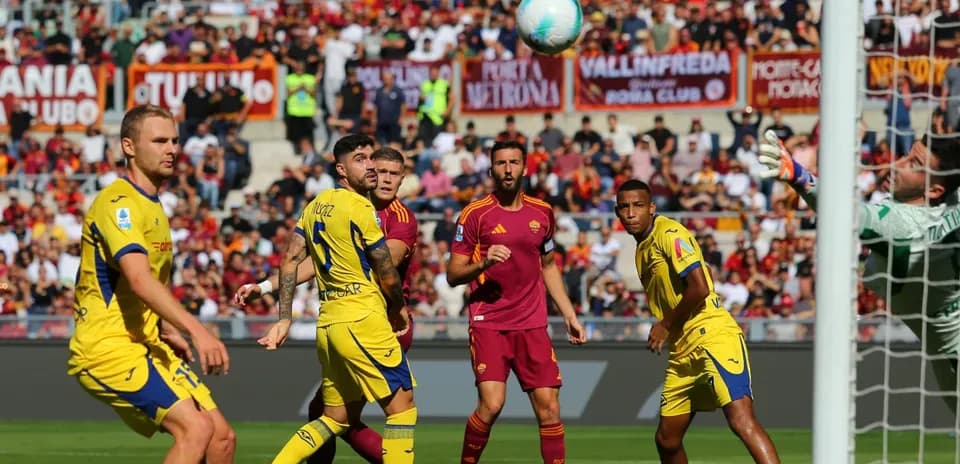 Players competing for the ball during Serie A match