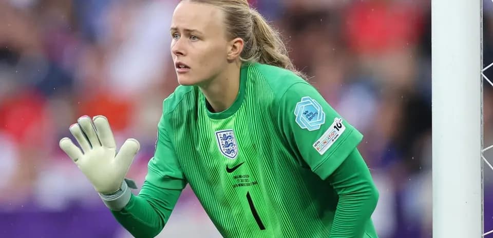 Goalkeeper in green jersey preparing for play