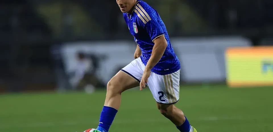 Player dribbling the ball on the field