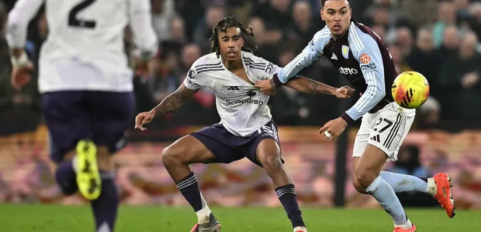 Players contesting the ball during Premier League match