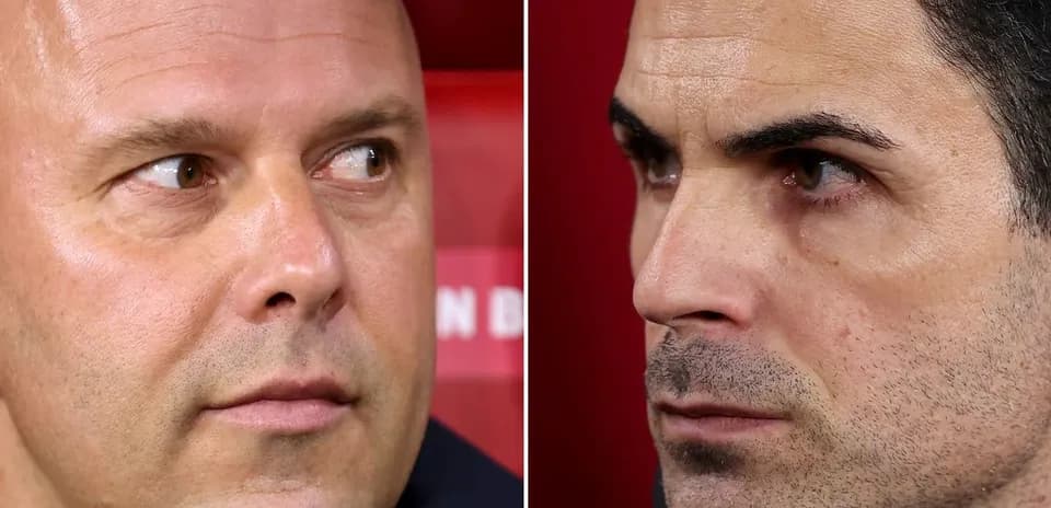 Two football managers focused during a match