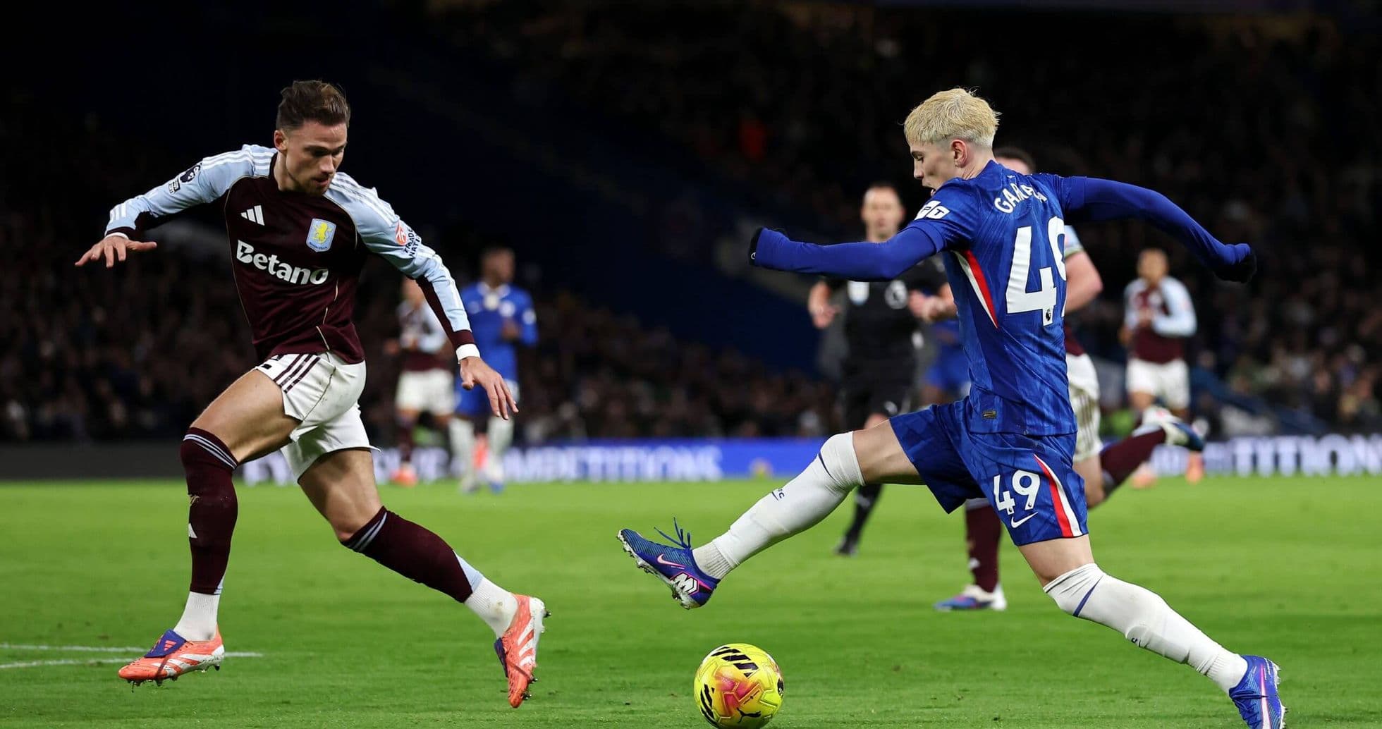 Aston Villa and Chelsea players in action