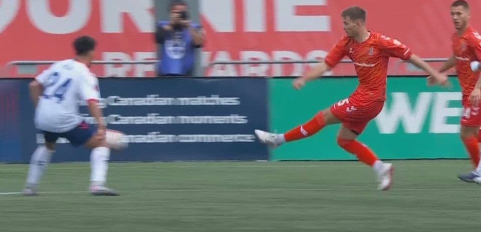 Player from Forge FC kicking the ball