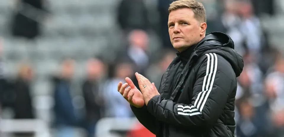 Manager applauding fans during match at stadium