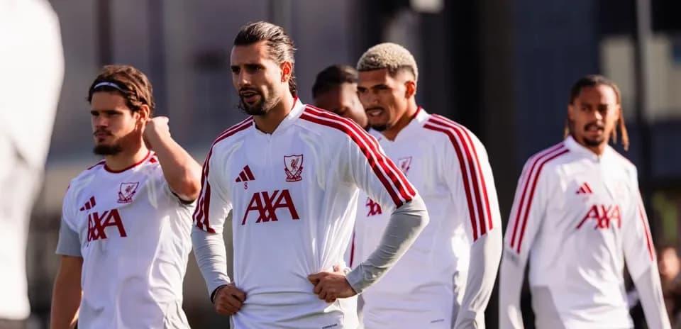 Liverpool players during training session on pitch