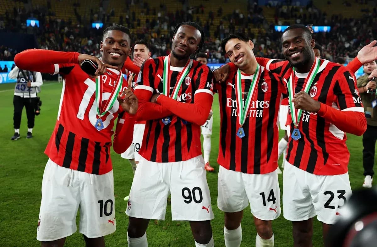 AC Milan players celebrating with medals after match