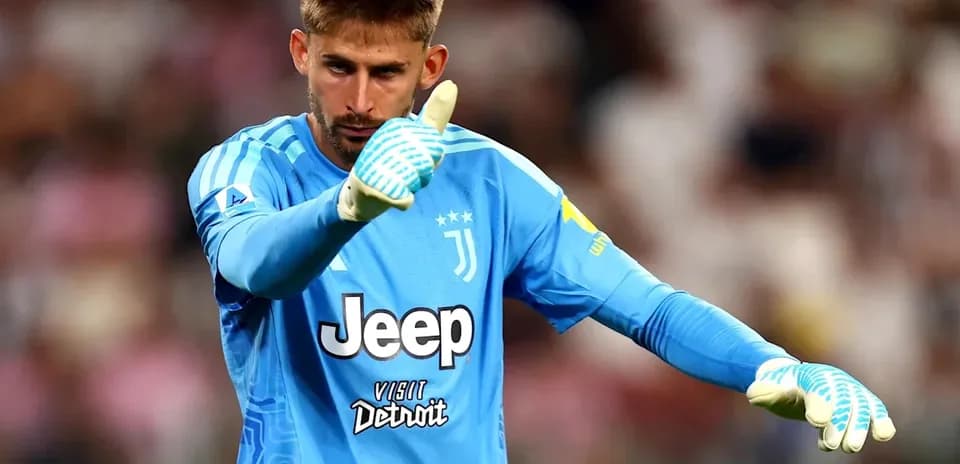 Goalkeeper in blue jersey gesturing during match