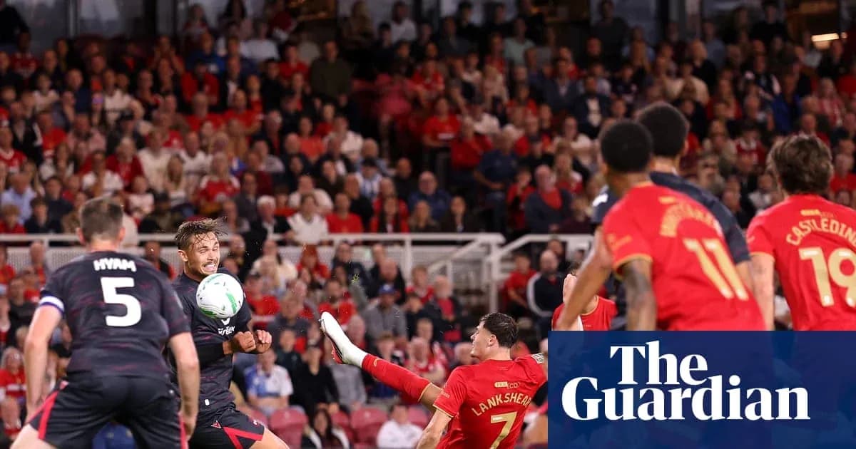 Players contesting a ball during a football match