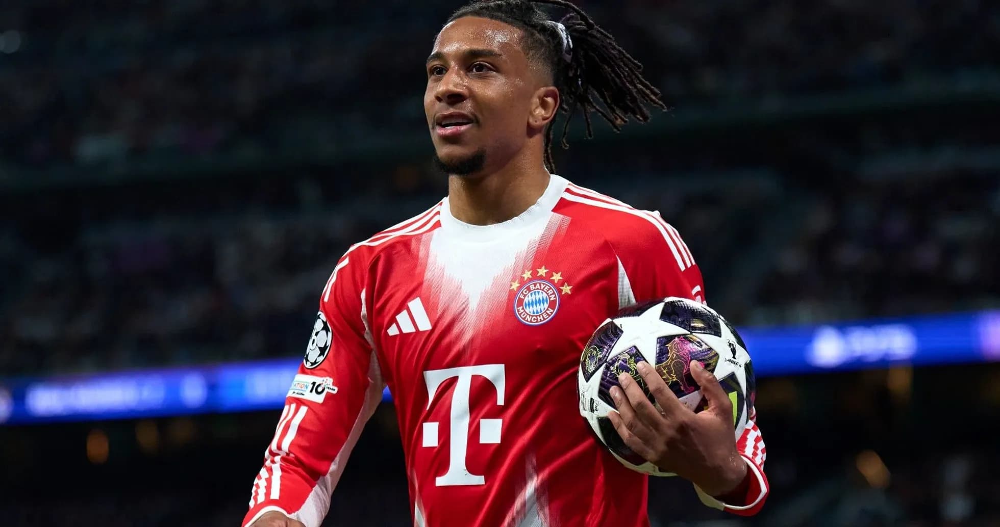 Player holding a Champions League ball during match