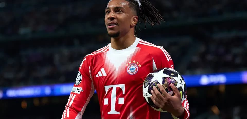 Player holding a Champions League ball during match