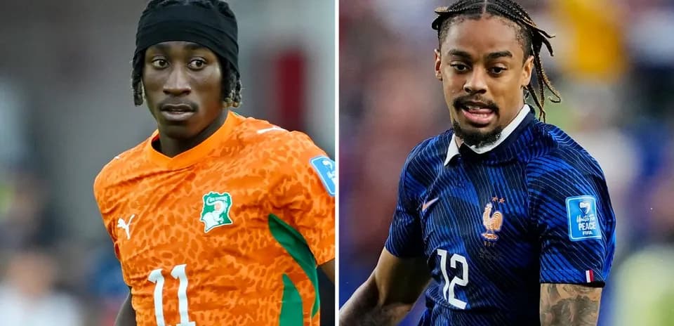 Two football players in national team kits