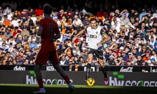 Valencia player dribbling the ball during match