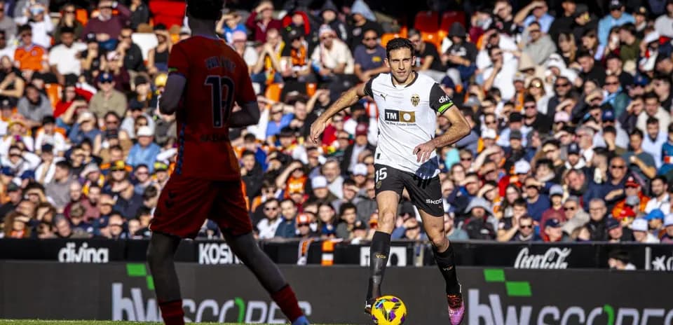 Valencia player dribbling the ball during match